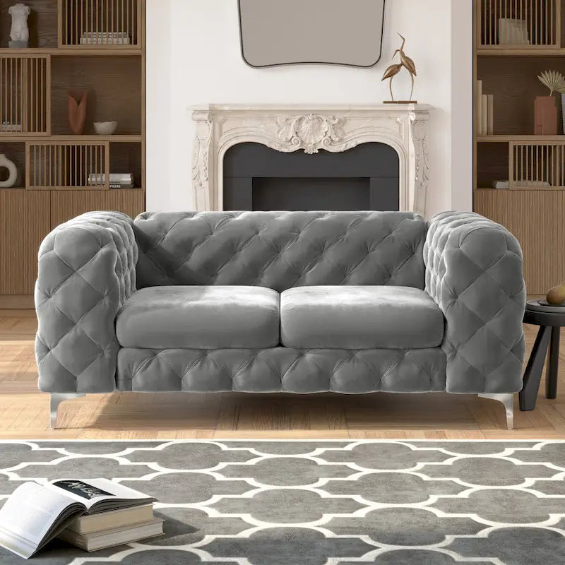 Causeuse chesterfield en velours capitonné