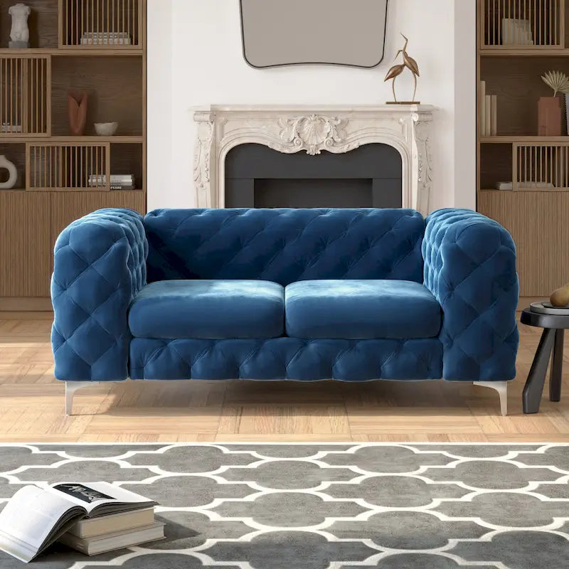 Causeuse chesterfield en velours capitonné