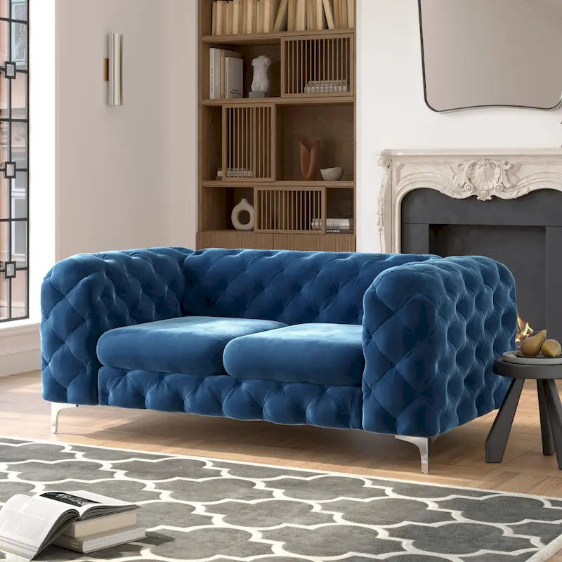 Causeuse chesterfield en velours capitonné