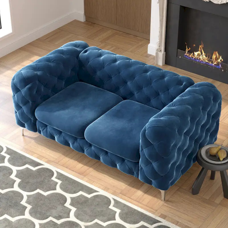 Causeuse chesterfield en velours capitonné
