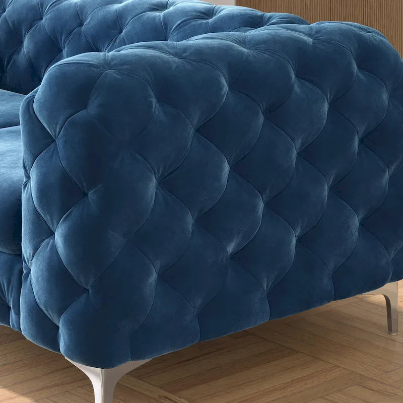 Causeuse chesterfield en velours capitonné