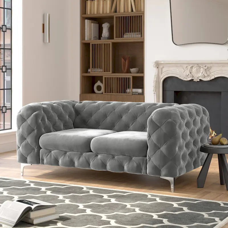Causeuse chesterfield en velours capitonné