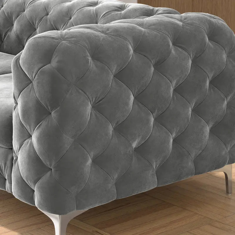 Causeuse chesterfield en velours capitonné