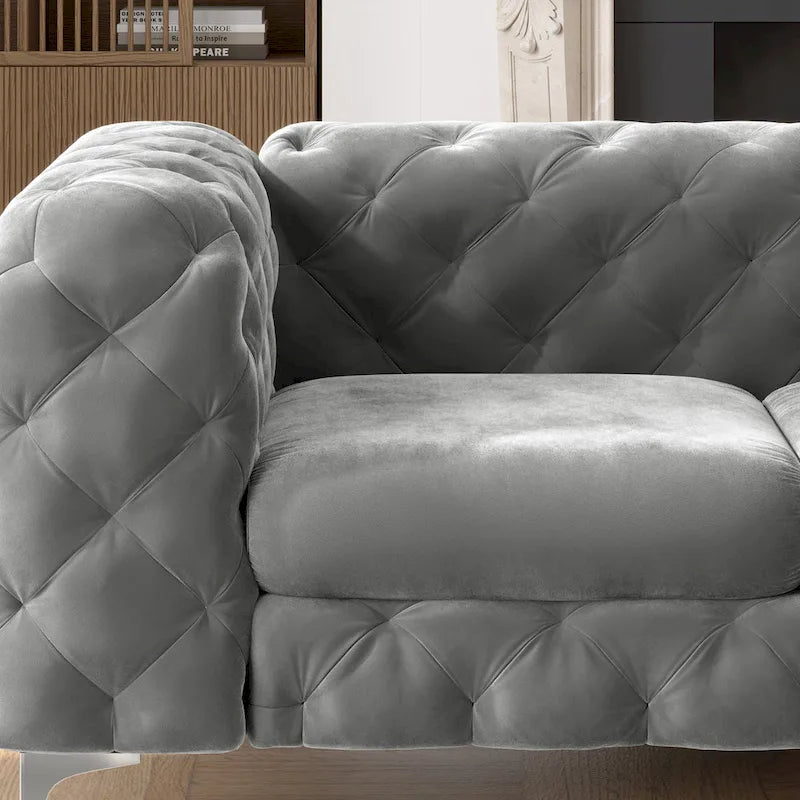 Causeuse chesterfield en velours capitonné