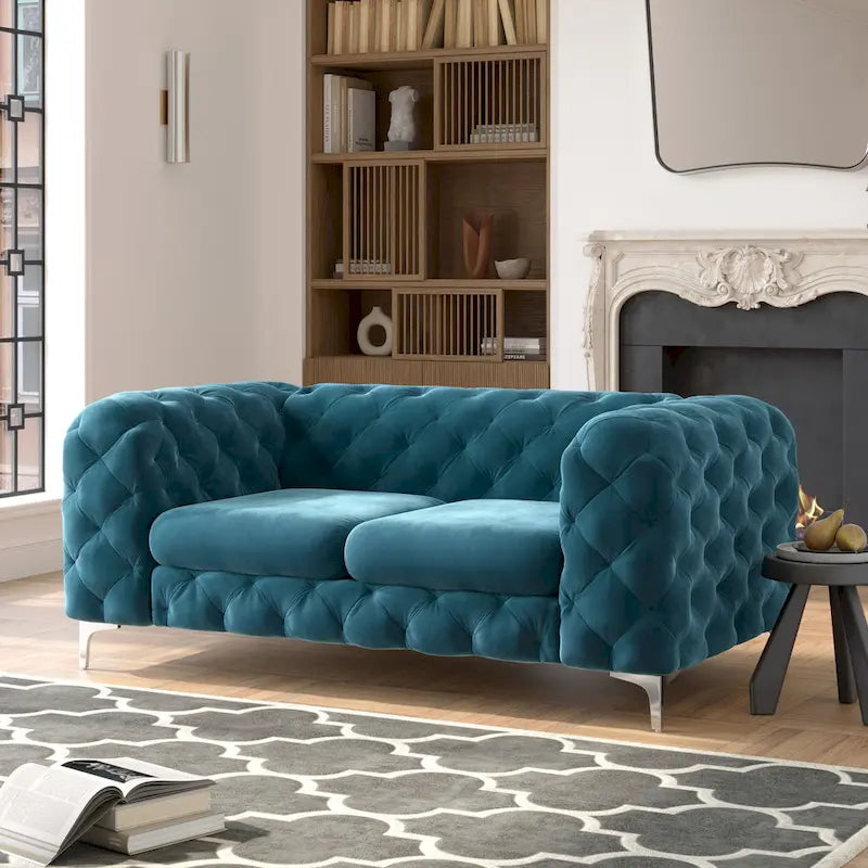 Causeuse chesterfield en velours capitonné
