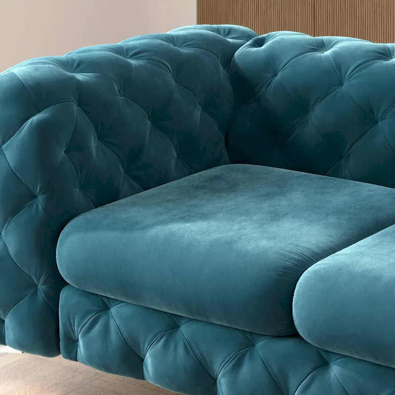 Causeuse chesterfield en velours capitonné