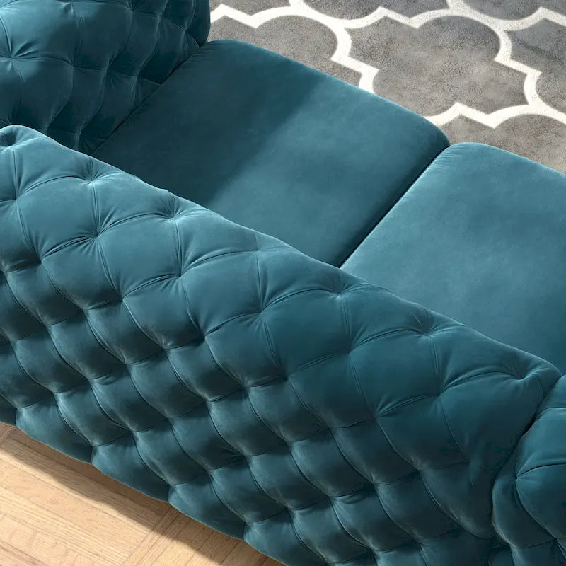 Causeuse chesterfield en velours capitonné